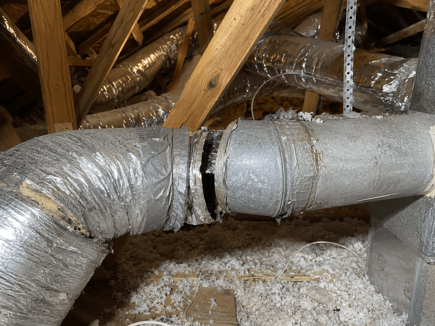 Damaged and leaking ductwork before repair and sealing by Kemah Air Duct Cleaning Texas